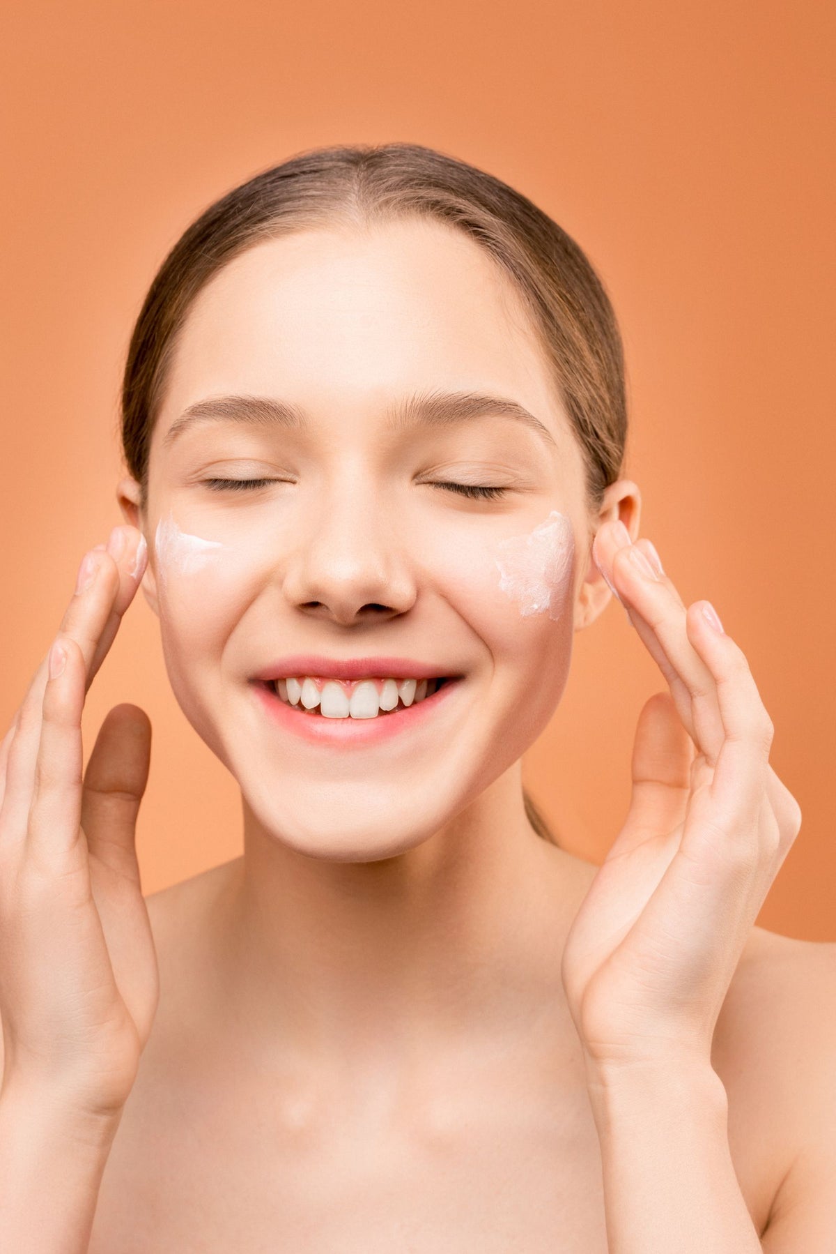 Facial moisturizer smoothed gently over the skin